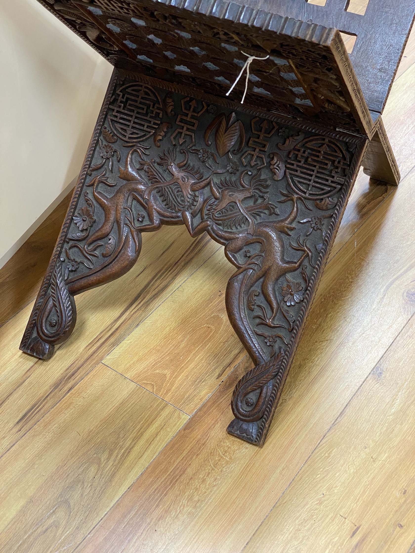 A Chinese carved hardwood folding scriptures stand, height 56cm